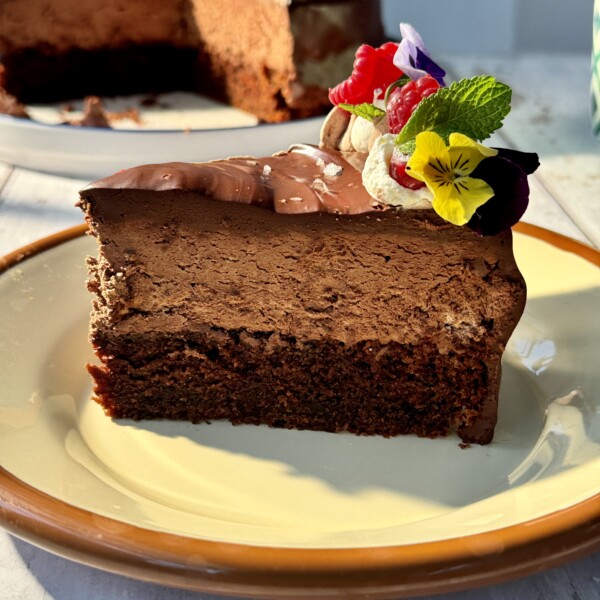 a slice of chocolate cake with chocolate mousse