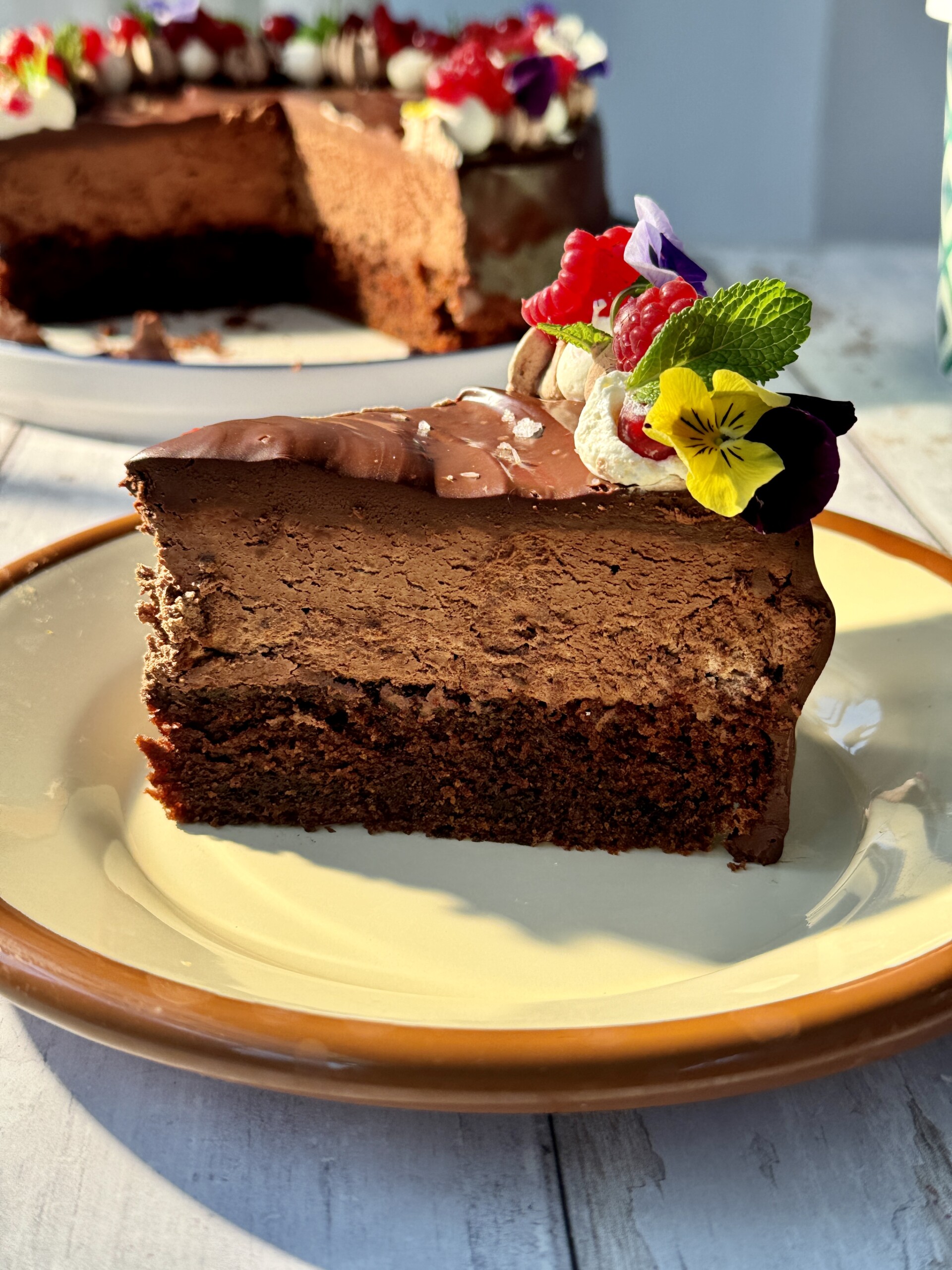 a slice of chocolate cake with chocolate mousse