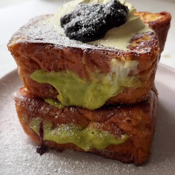 Topping the French toast with Blackcurrant jam.