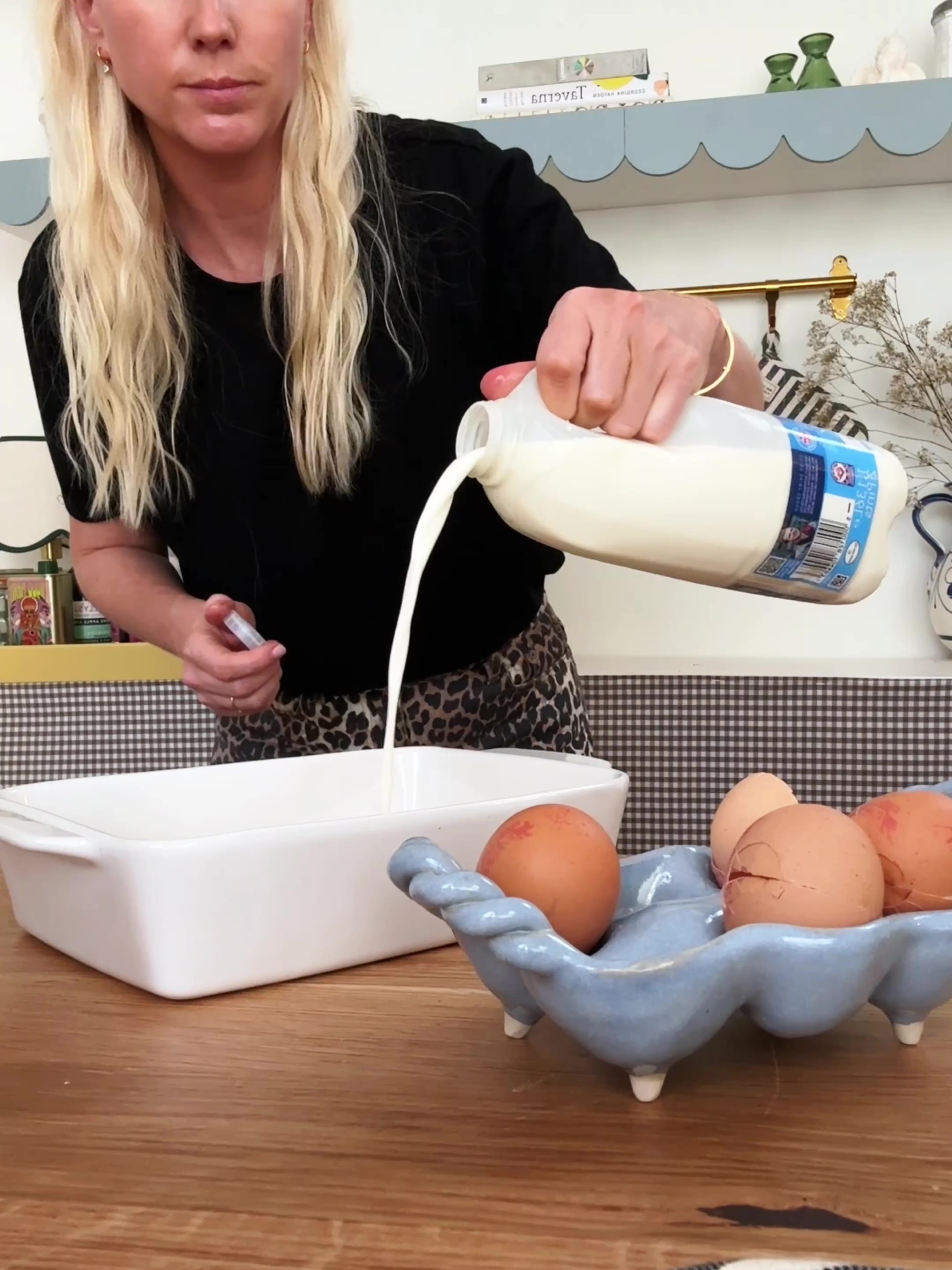 Adding milk to a baking dish