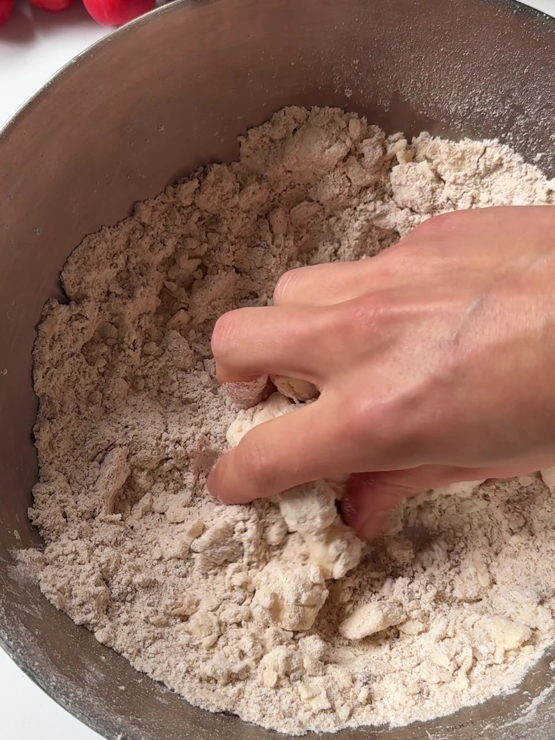 Rubbing butter into crumble mix