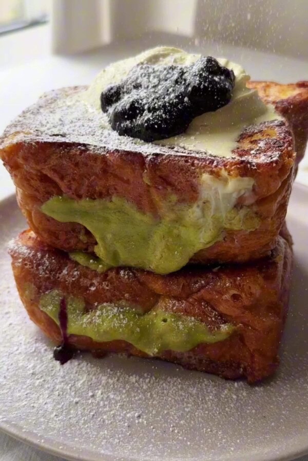 Pistachio Cream Brioche French Toast served in a plate