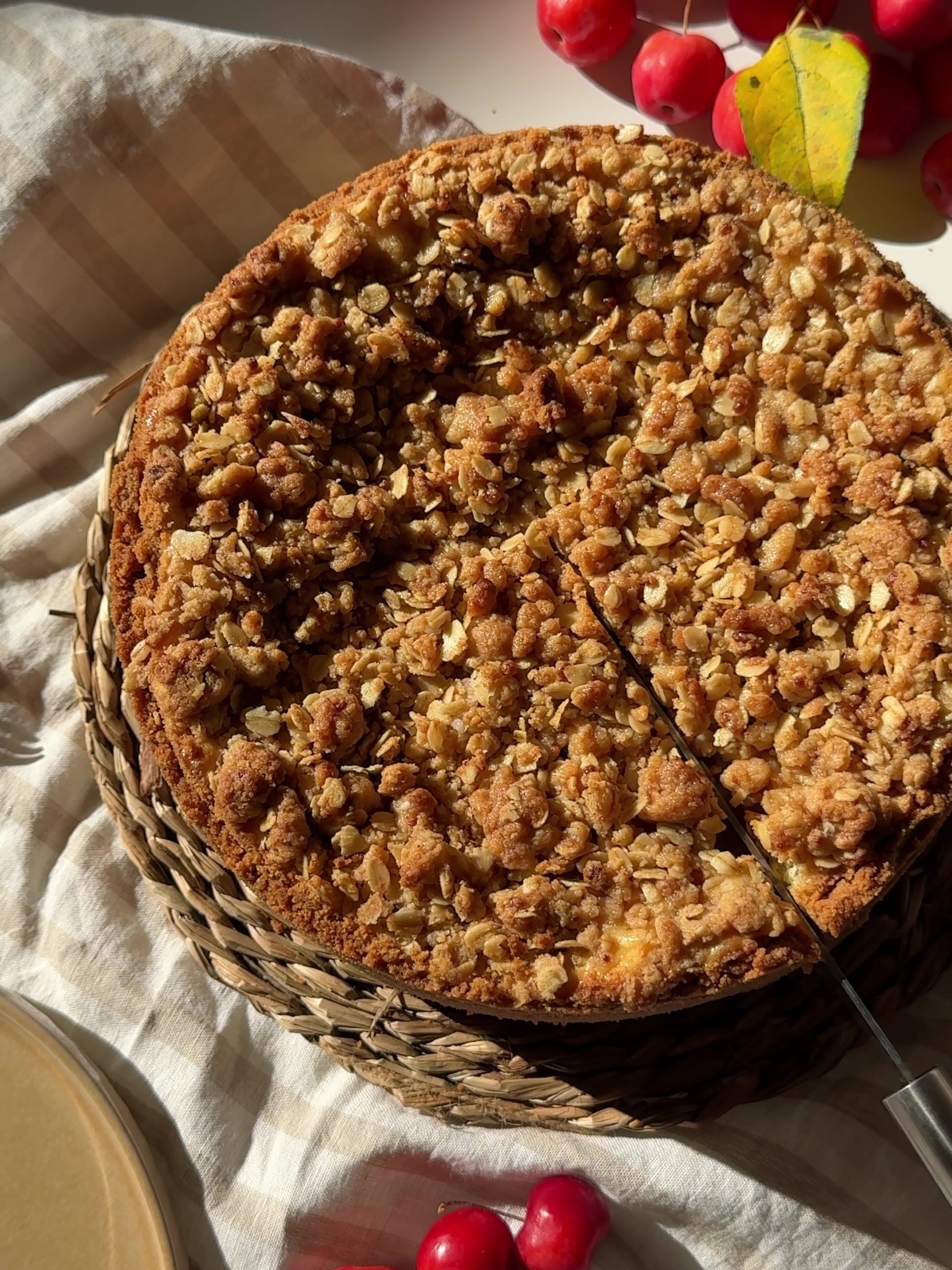 Freshly baked Apple Crumble Cheesecake in a biking tin