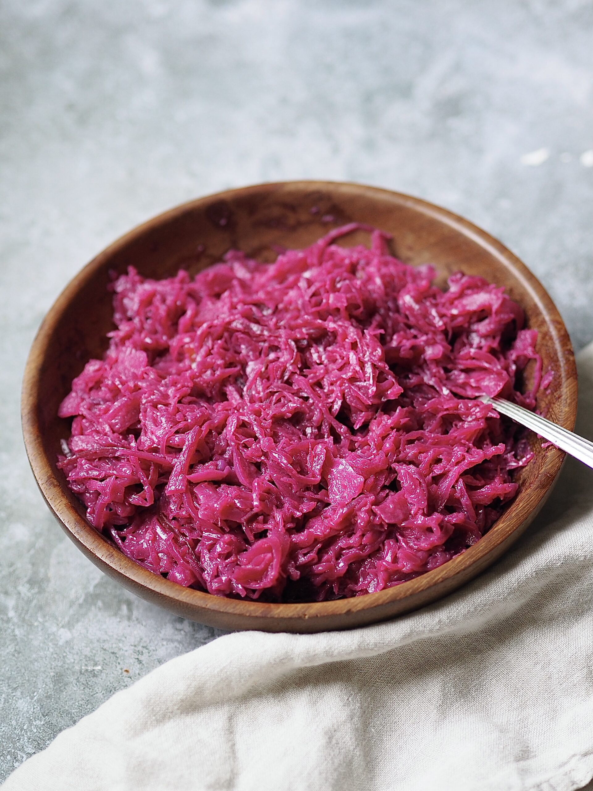 Wooden bowl of sticky red cabbage.