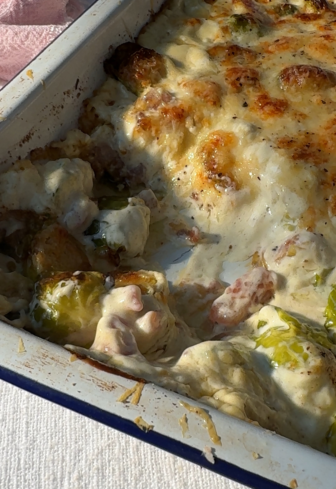 close up of Brussels sprout casserole in baking dish.