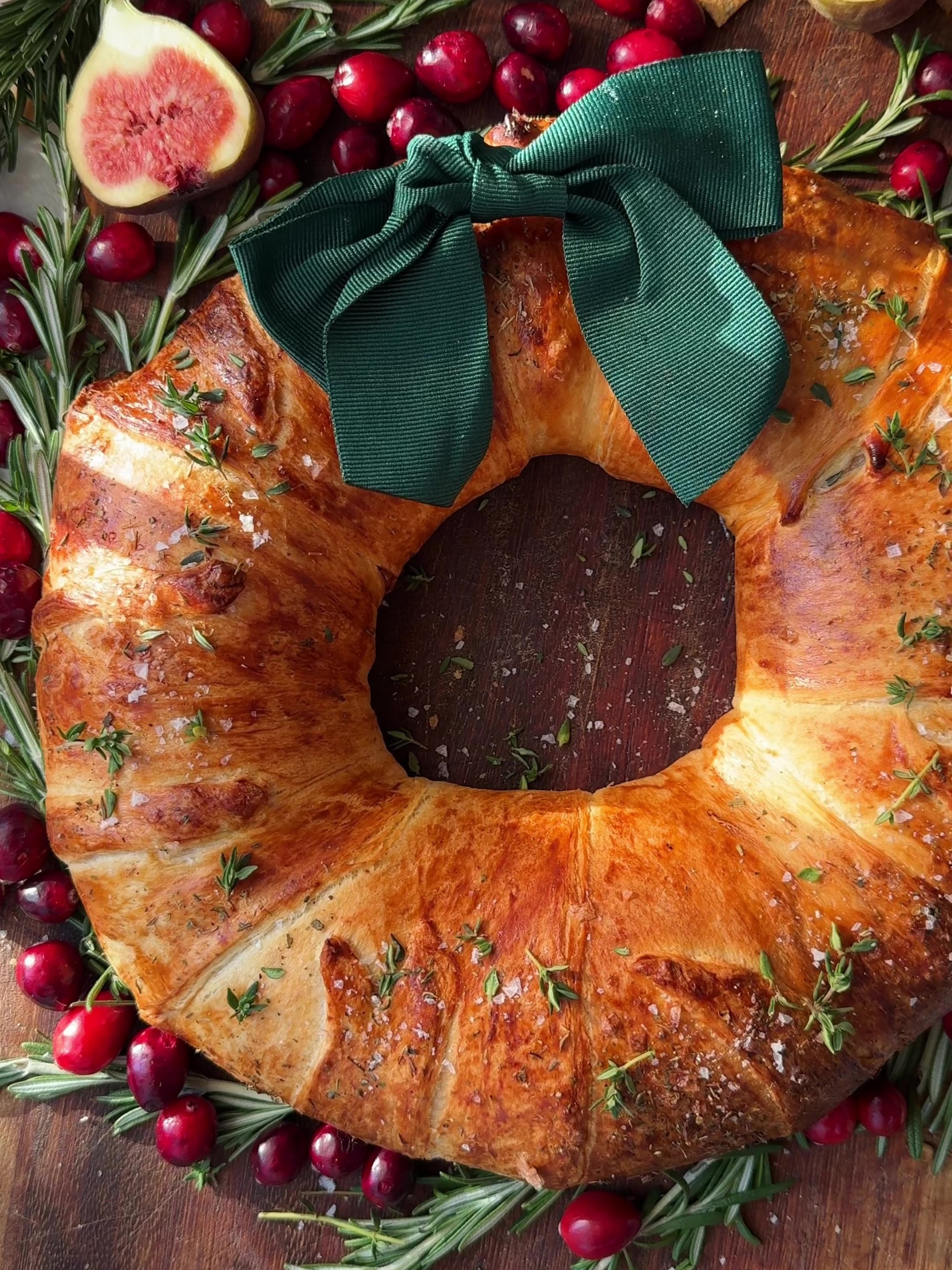 Brie Crescent Wreath with fresh figs on a board