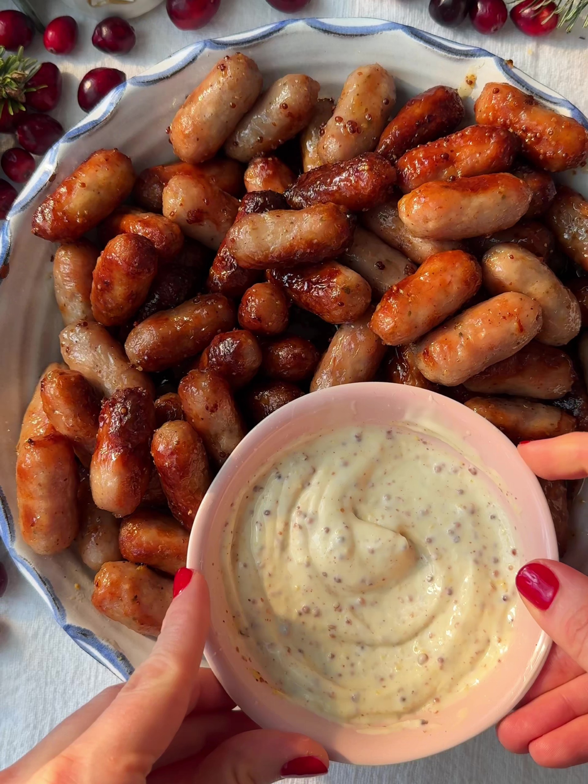 Honey Mustard Sausages in a plate with a dipping sauce.