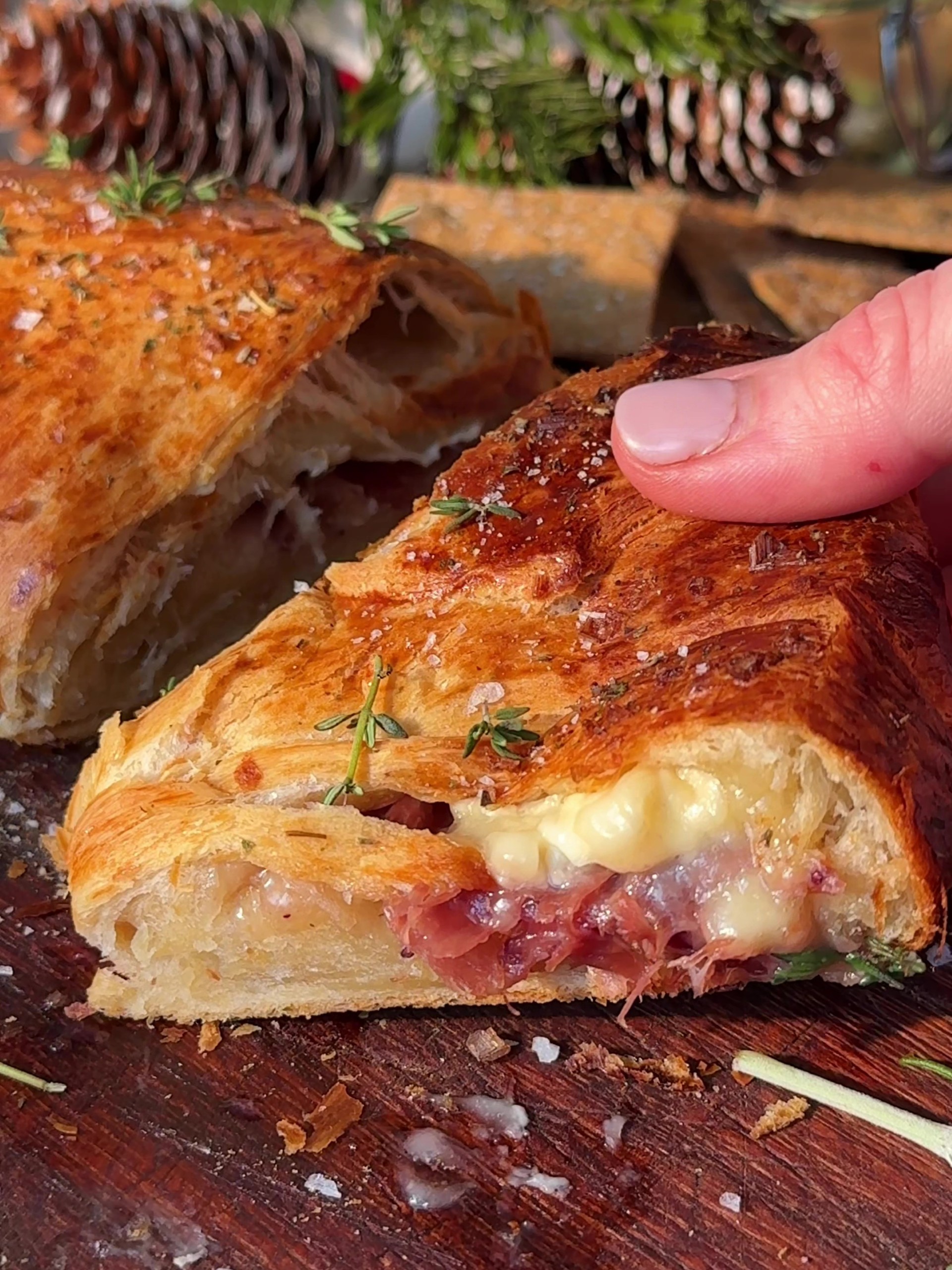 Holding a slice of Brie Crescent Wreath