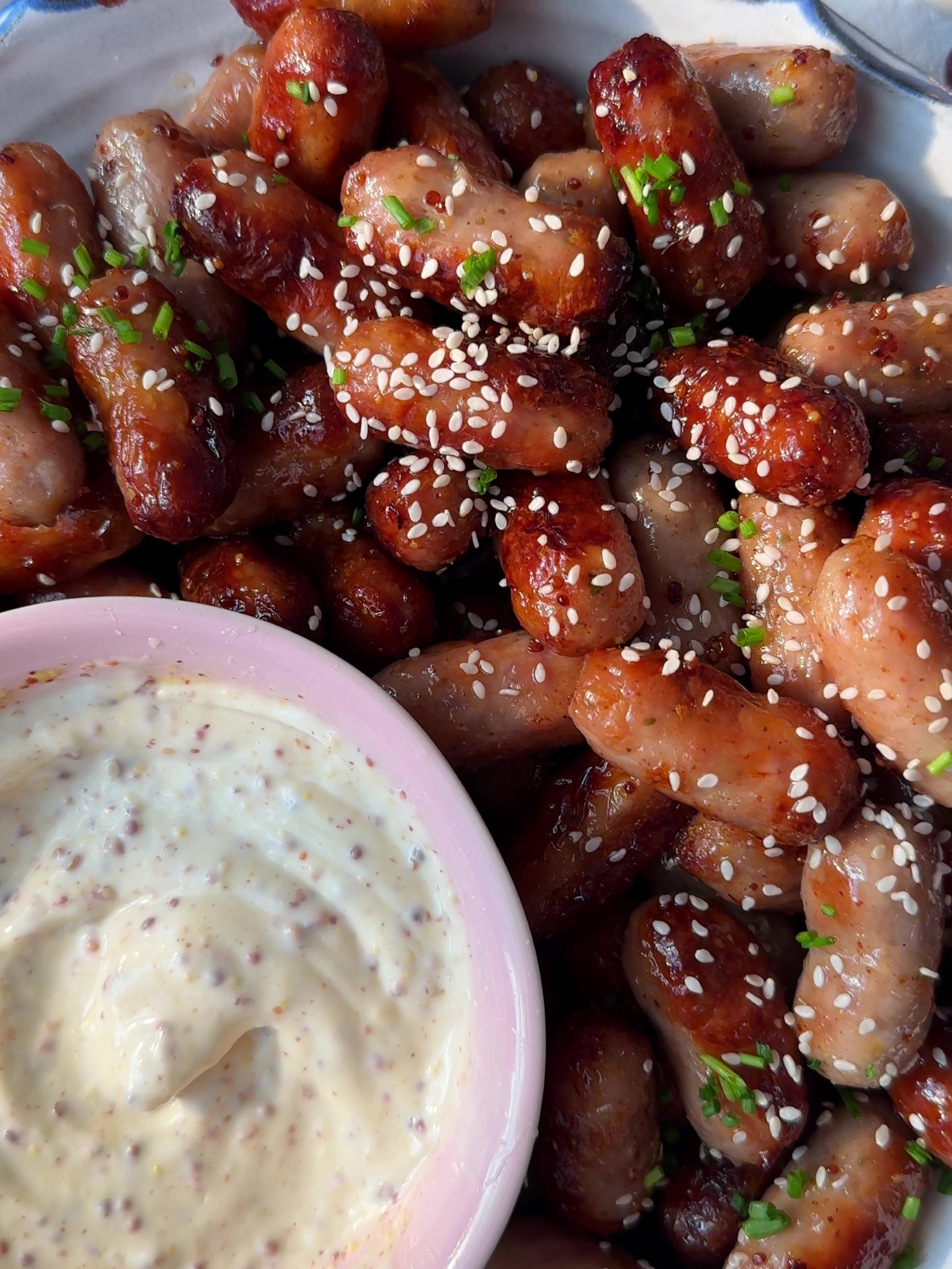 Honey Mustard Sausages with a bowl of mayo and mustard dip