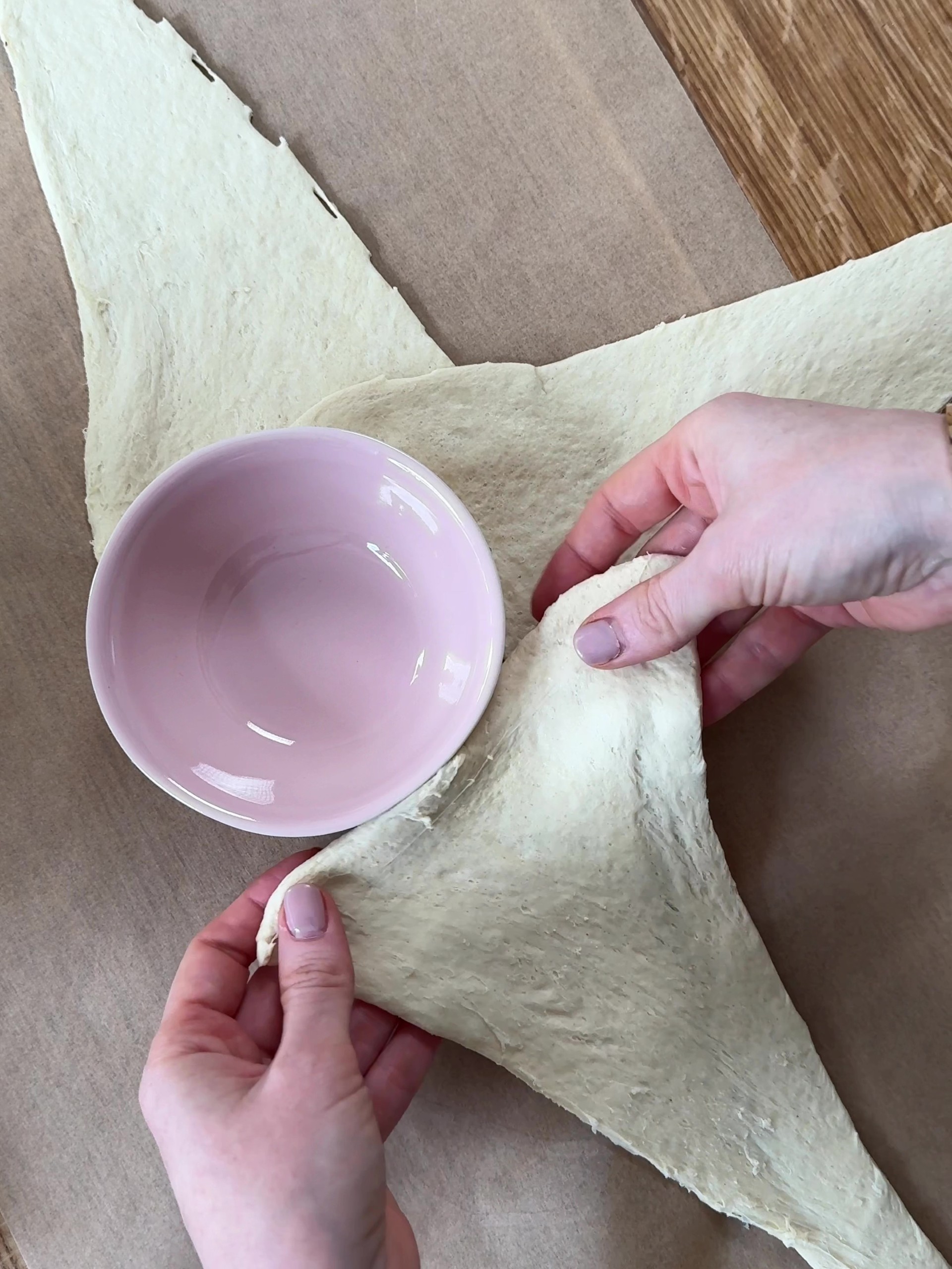 Placing croissant dough around the ramekin