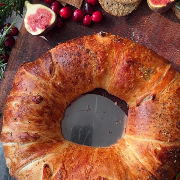 Serving the Brie Crescent Wreath with fresh figs