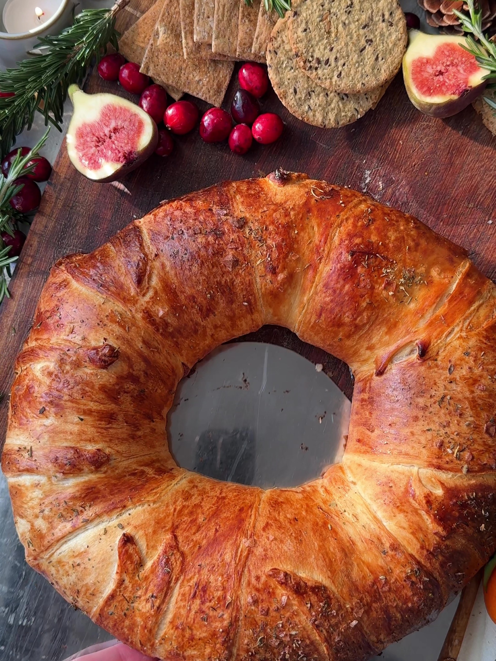 Serving the Brie Crescent Wreath with fresh figs