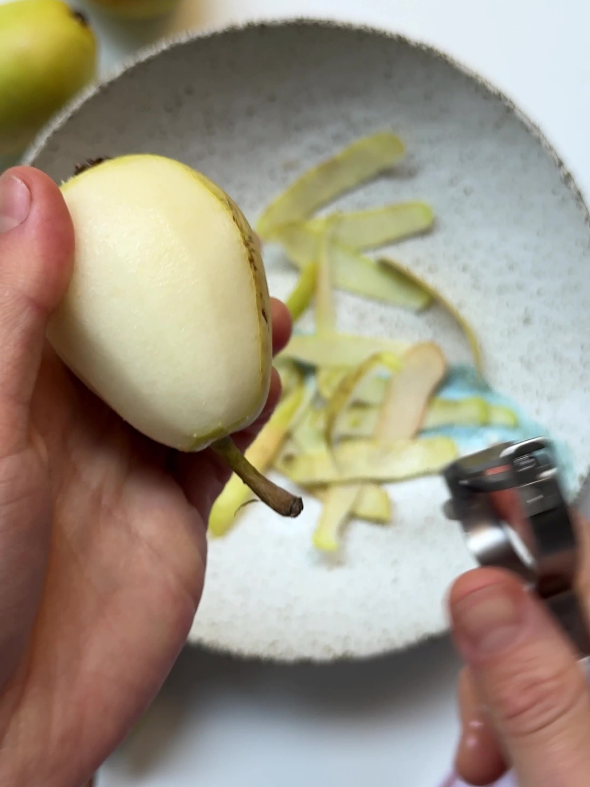 Peeling pears with a peeler