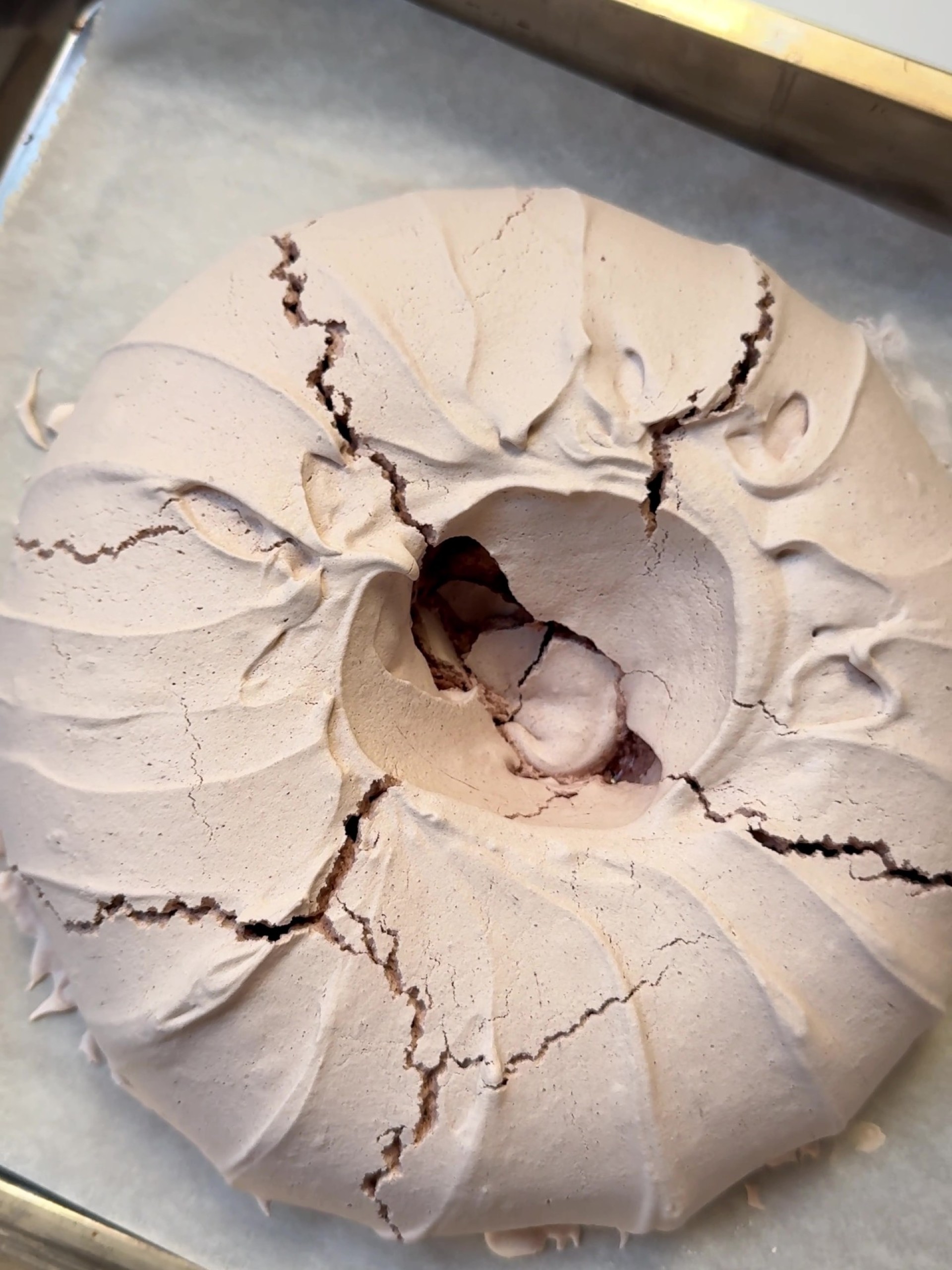 Cooling  the Christmas Pavlova on a baking tin