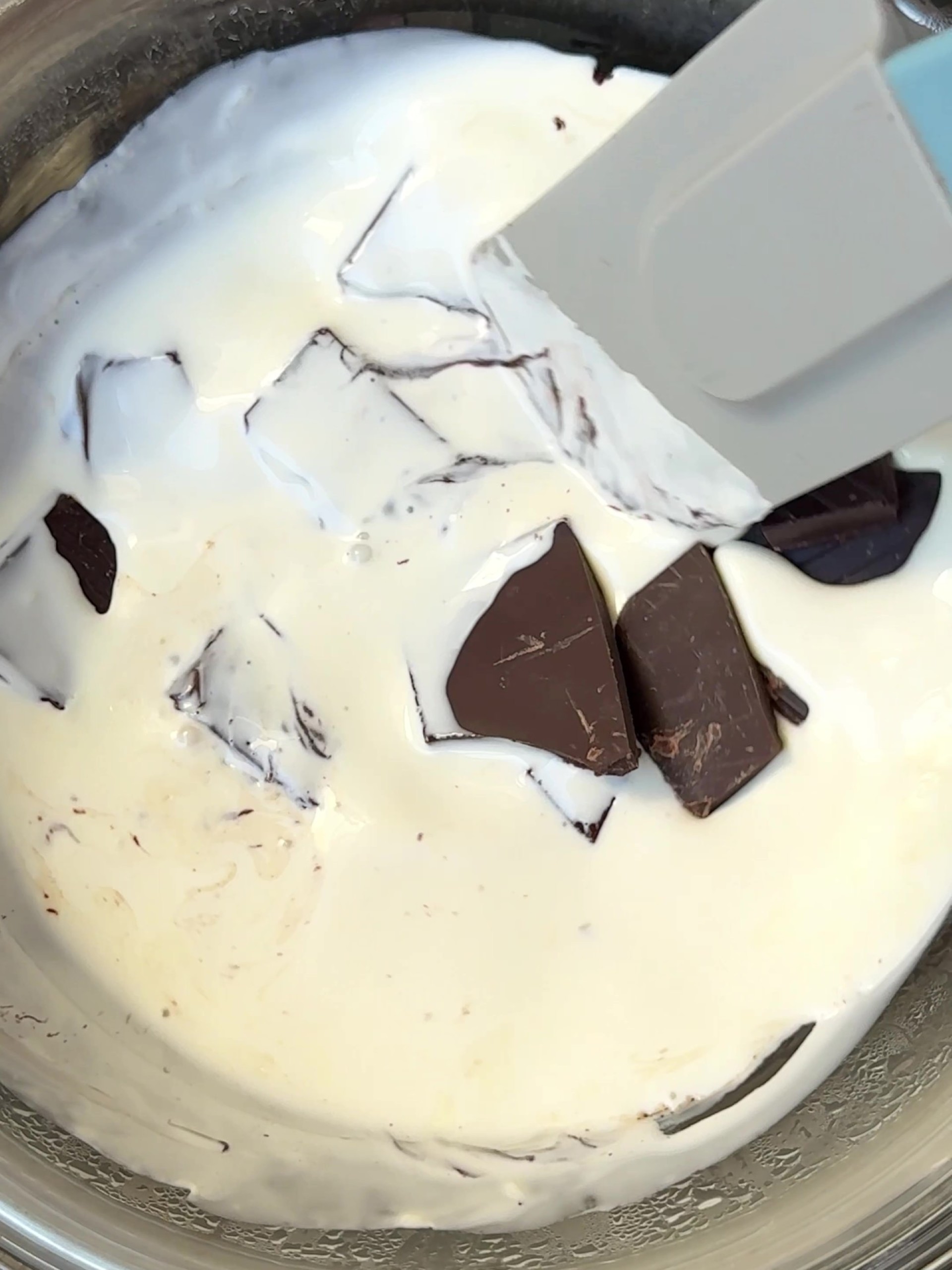 Adding chopped chocolate to cream