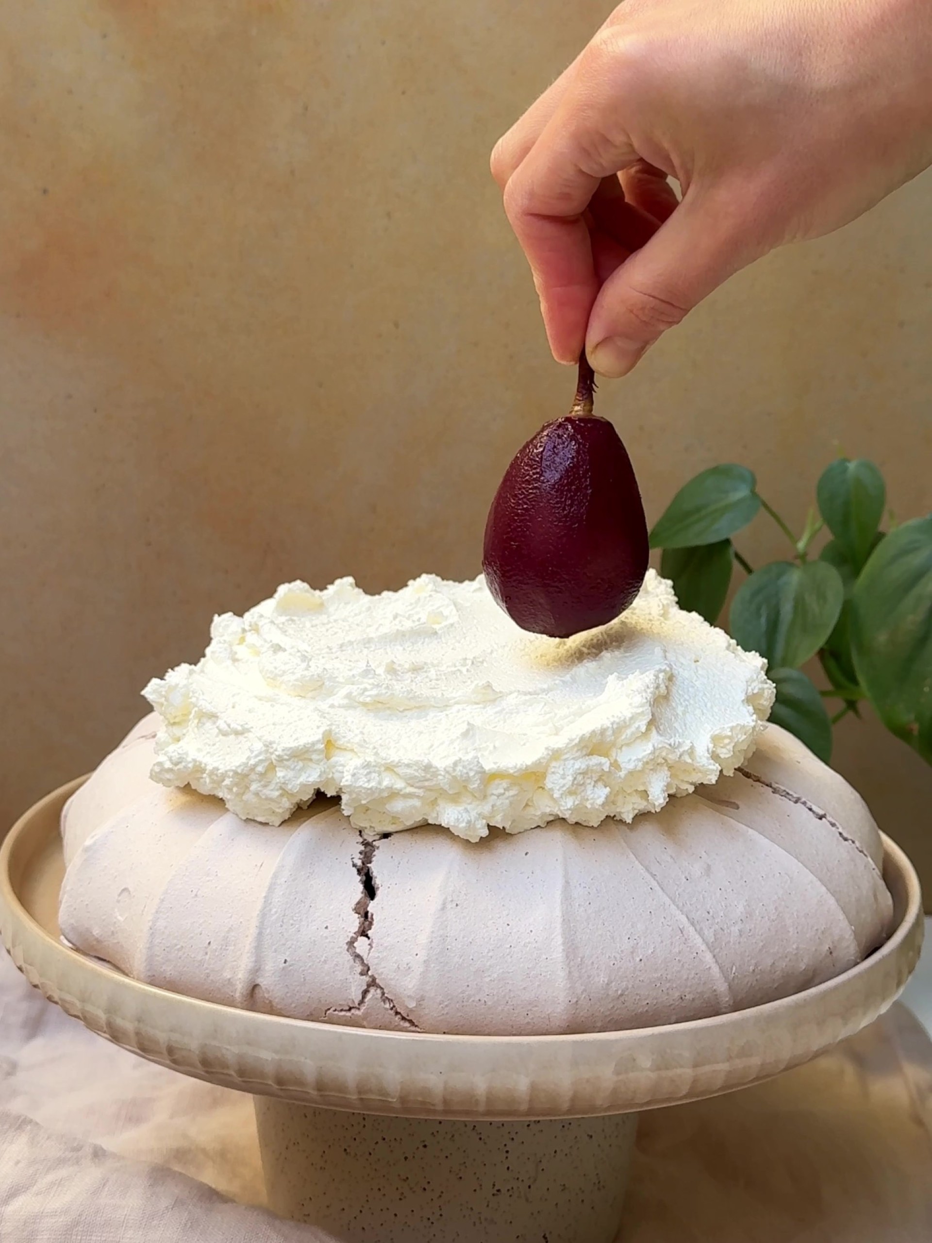 Adding a poached pear on top of the whipped cream