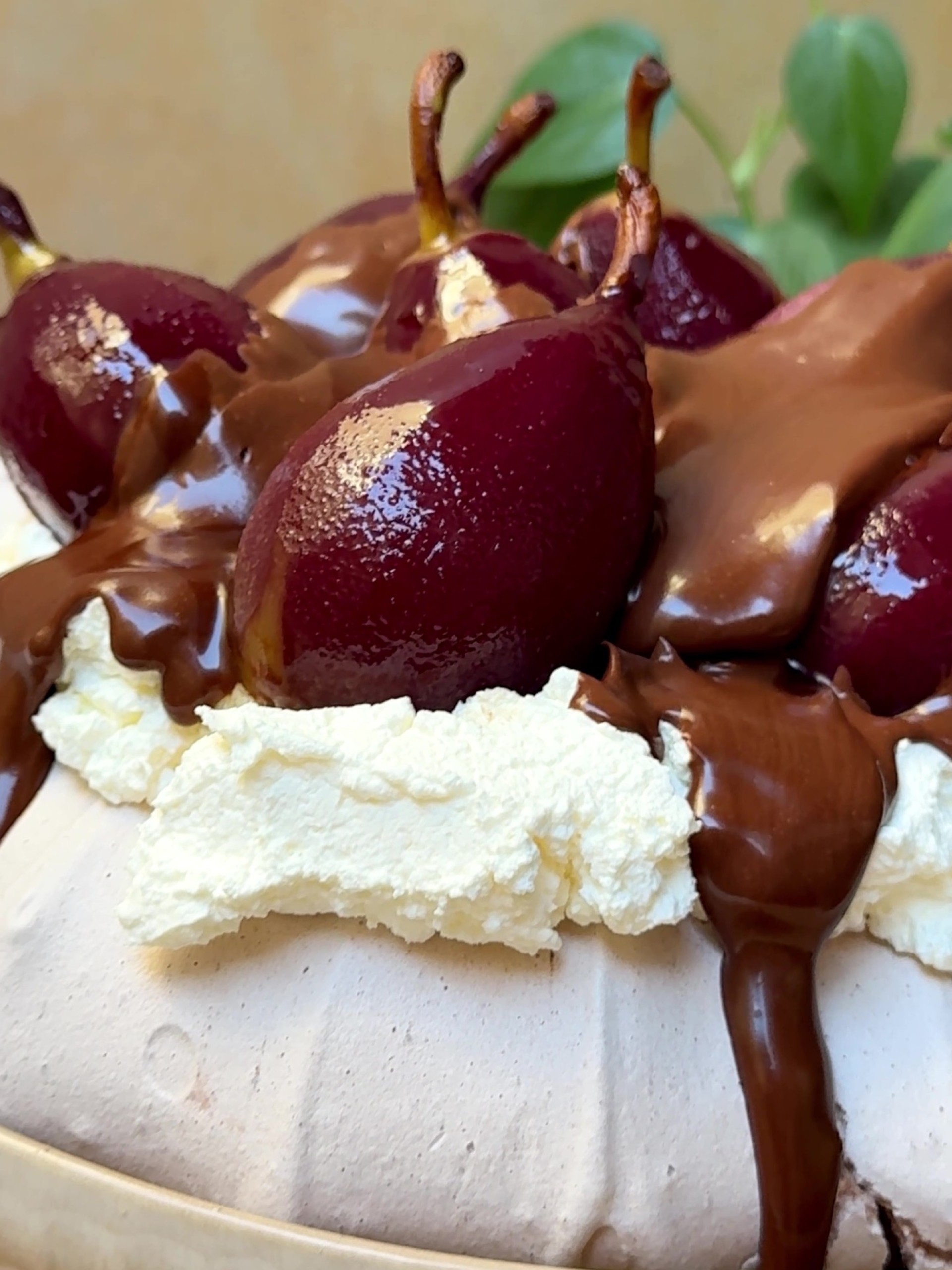 Pouring chocolate sauce over the pears