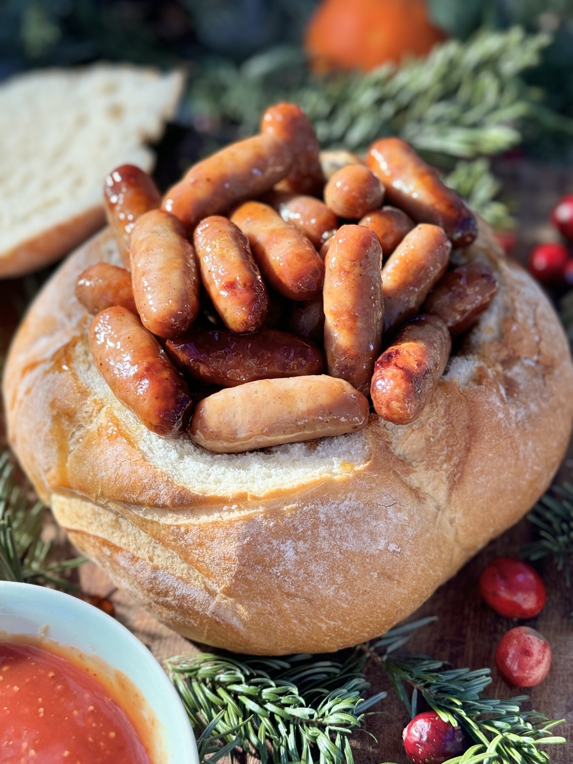 Sticky sausages in a bread bowl.