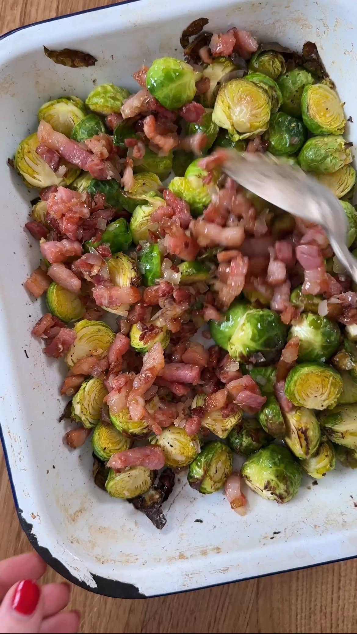 adding pancetta to the brussels sprouts.