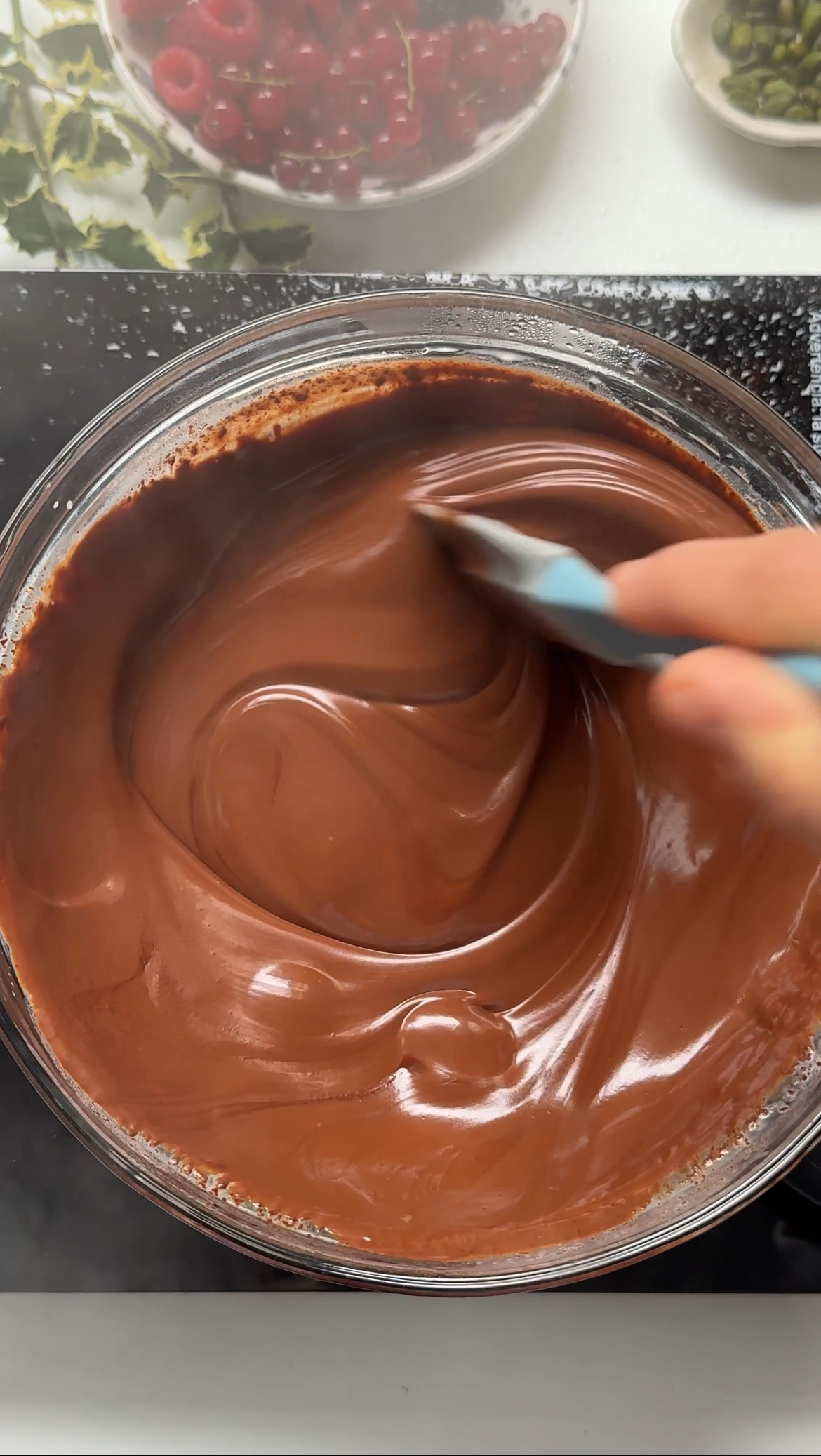 making chocolate ganache to decorate.