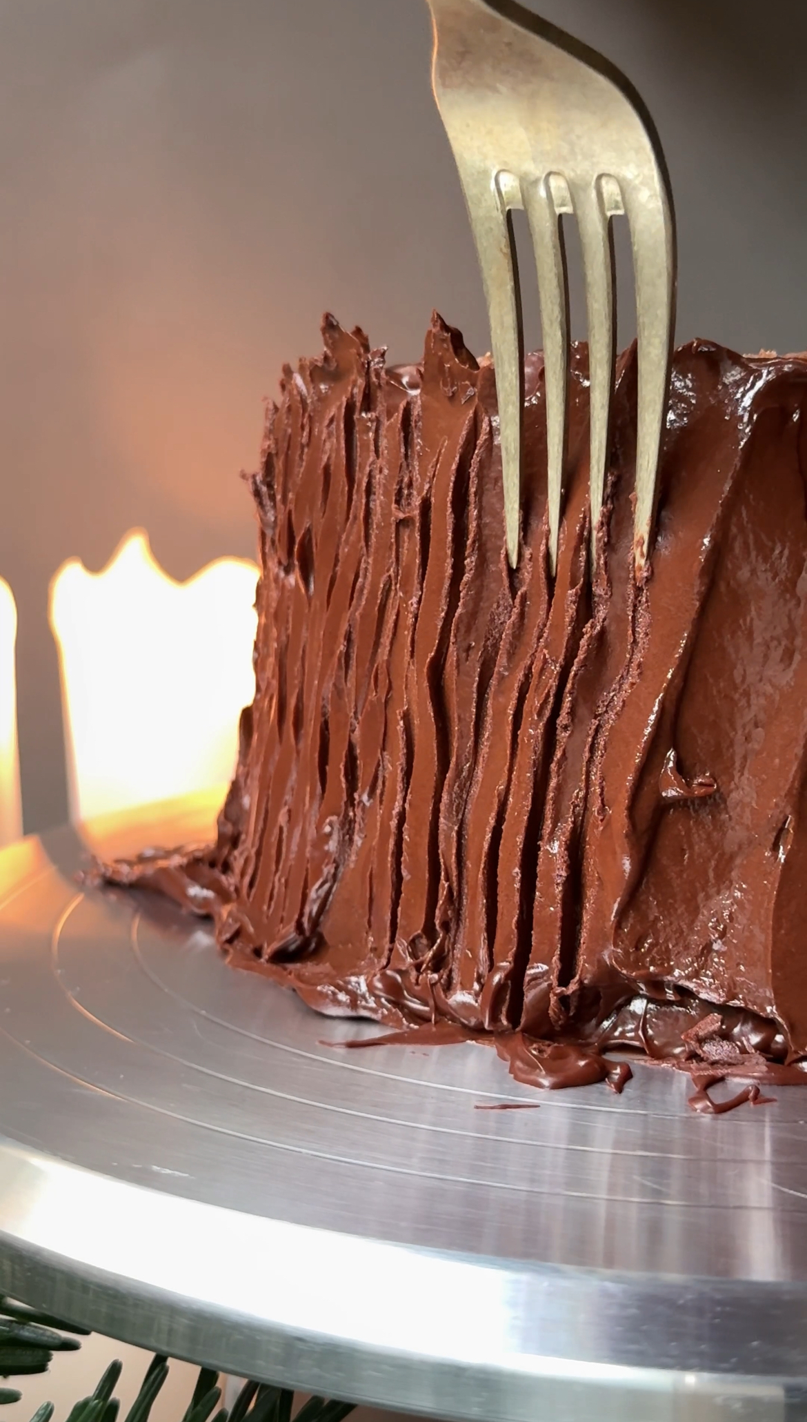 using a fork to make the lines of bark on the yule log. 