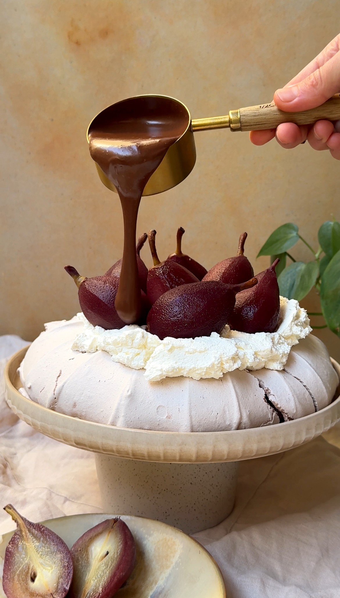 Pouring chocolate sause over Christmas Pavlova