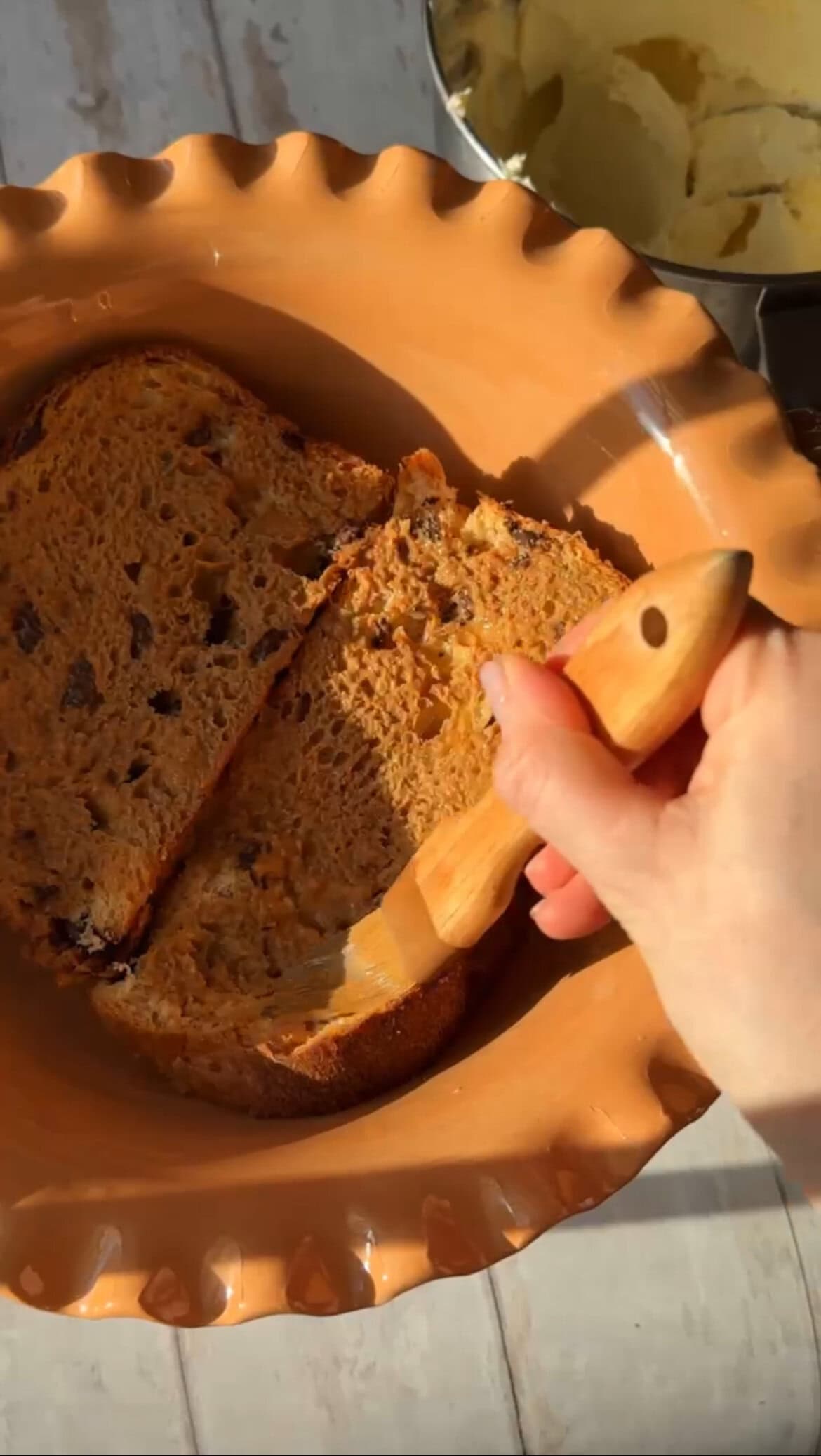 brushing the panettone with coffee.