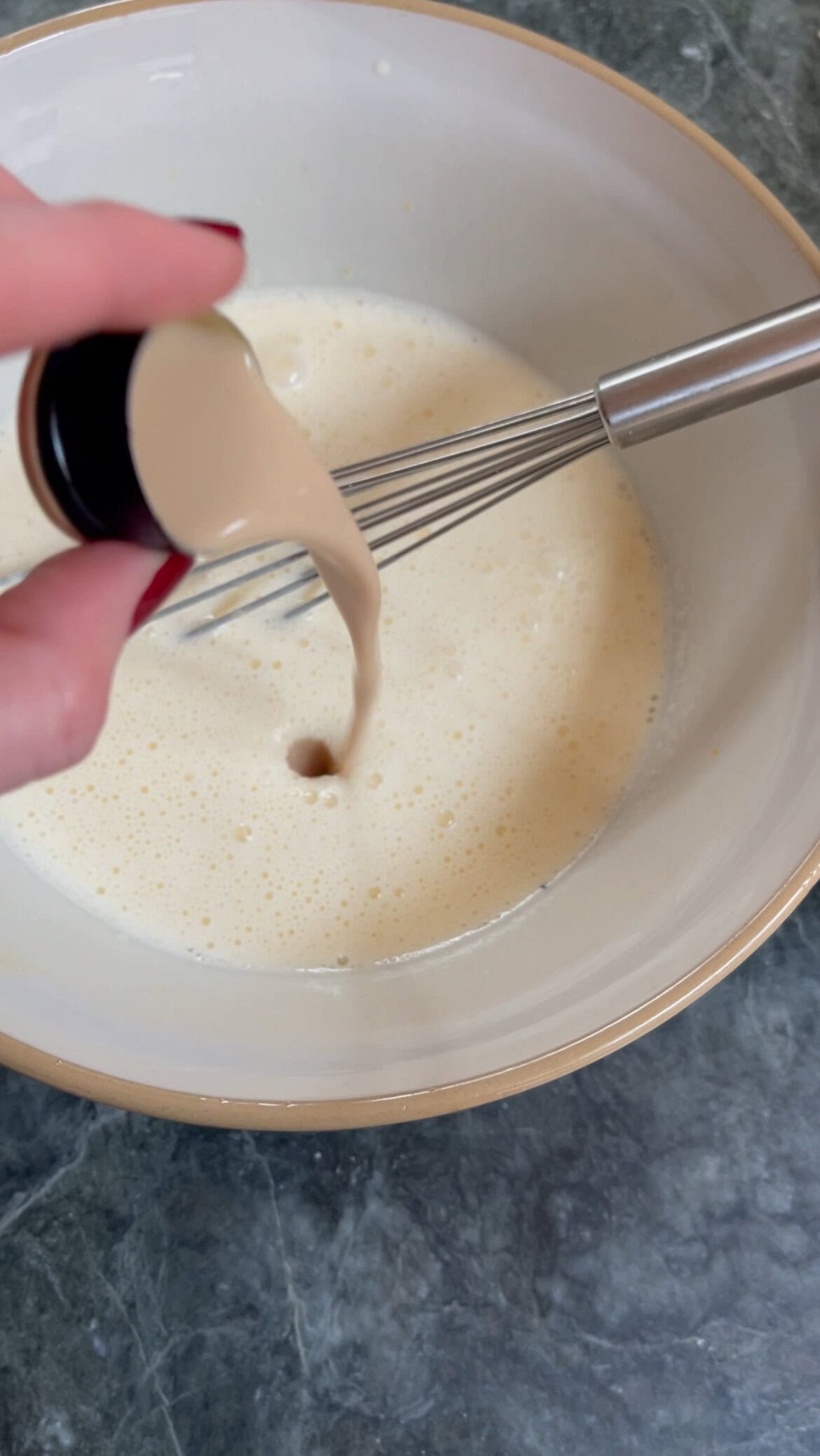 adding baileys to the mascarpone cream.