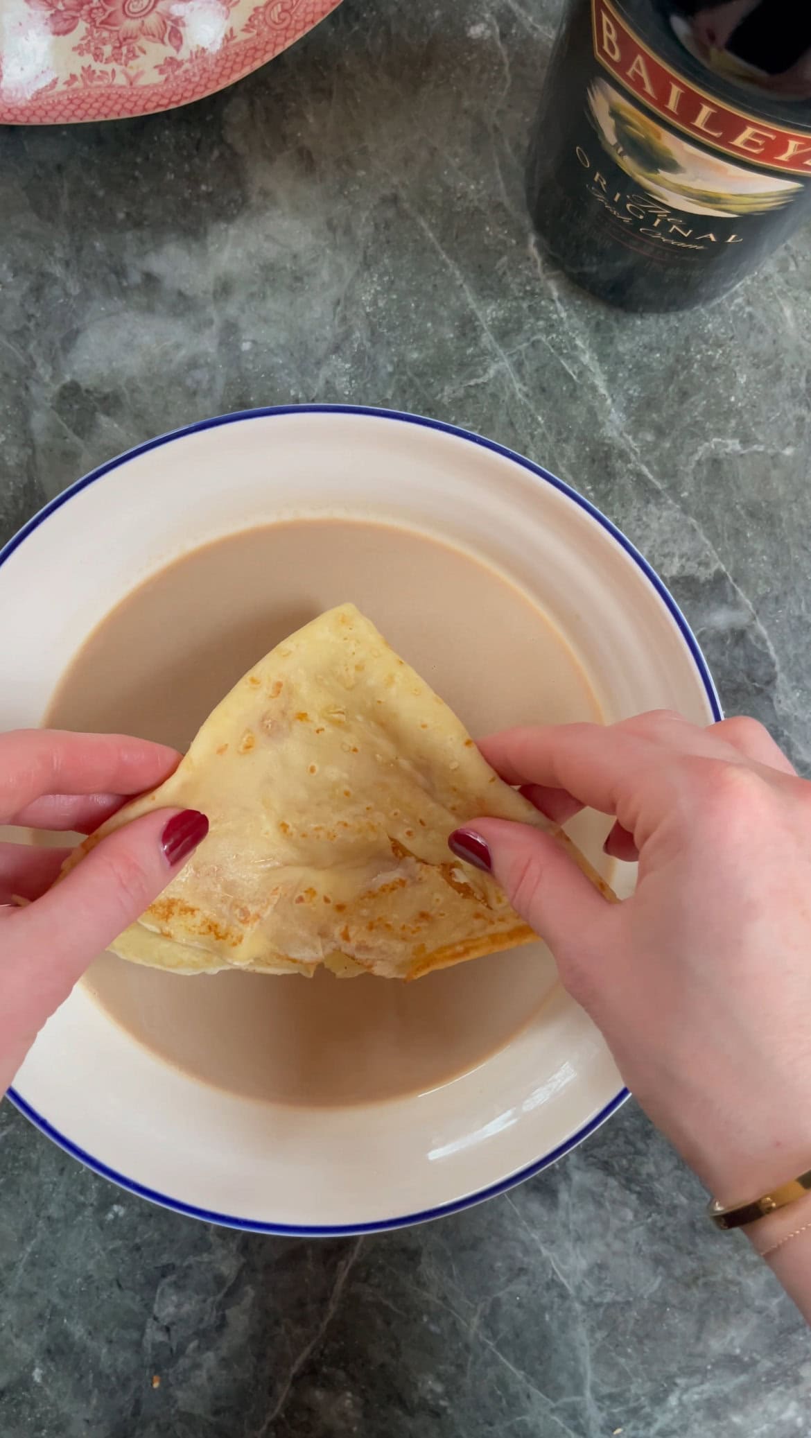 dipping pancake in coffee baileys soak.