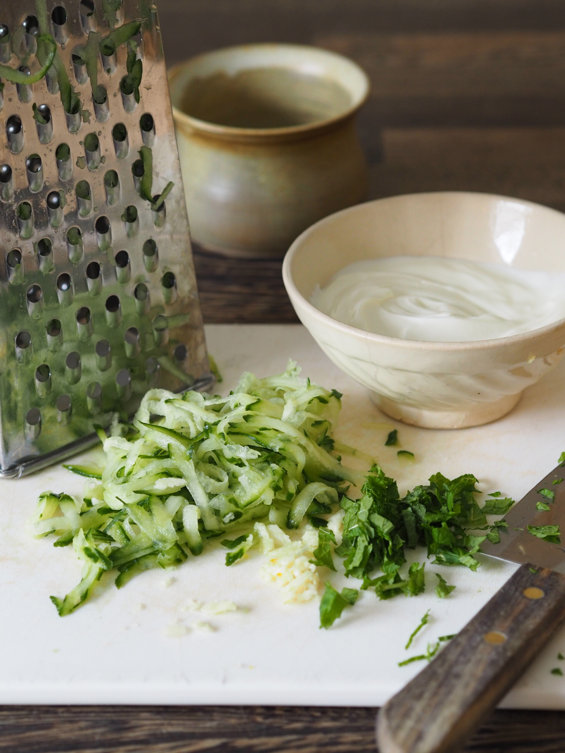 making raita for baked chicken skewers.