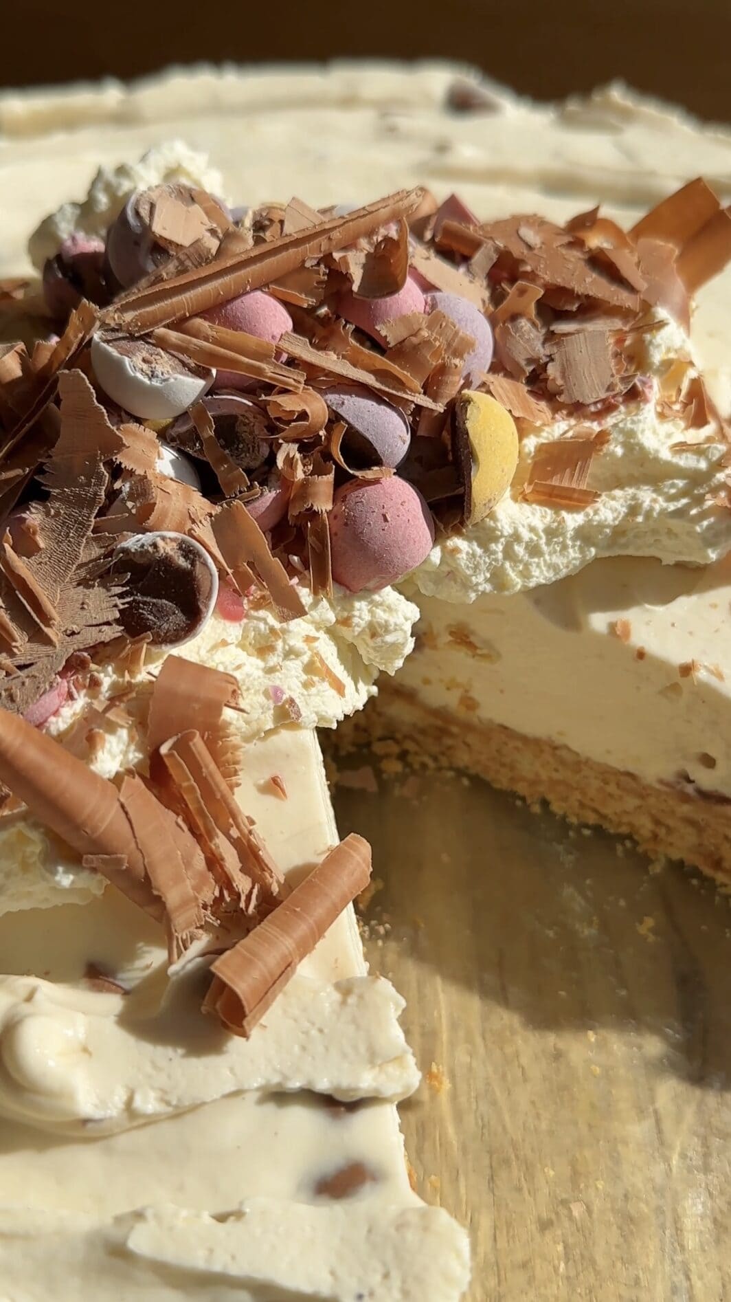 mini egg cheesecake with slice removed.