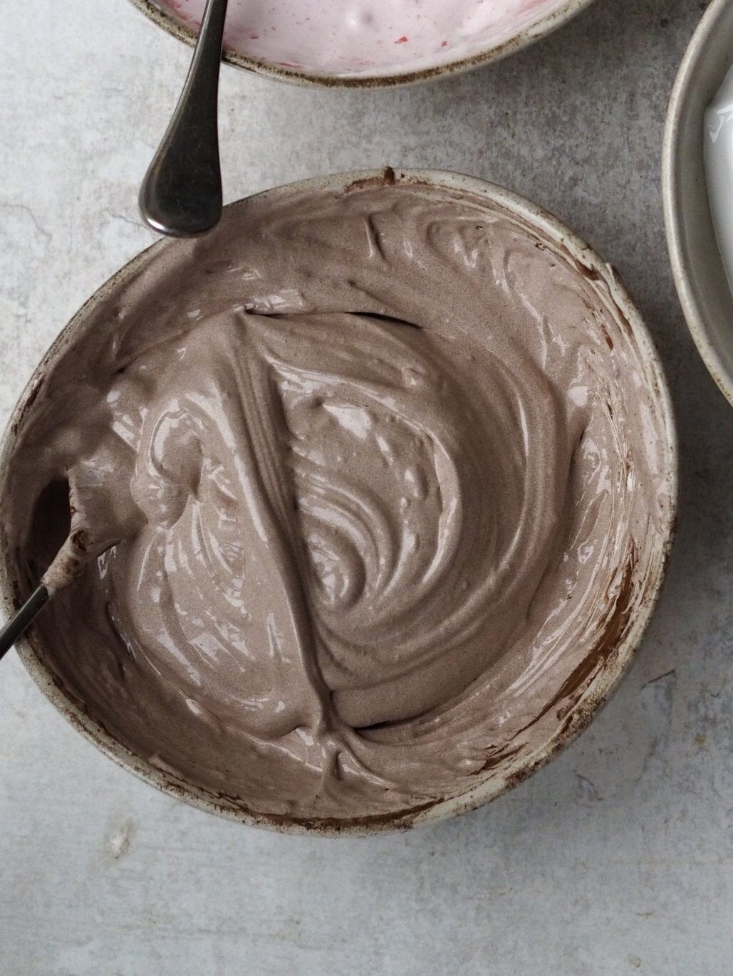 Marshmallow mixture in three bowls.