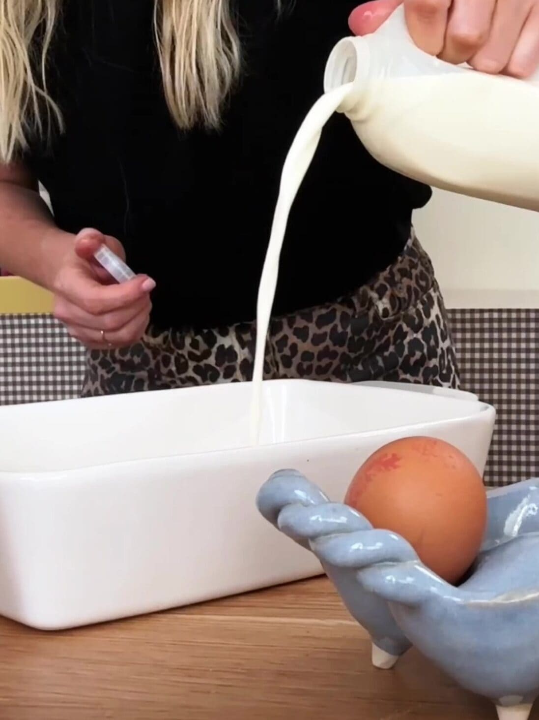 Adding milk to a baking dish