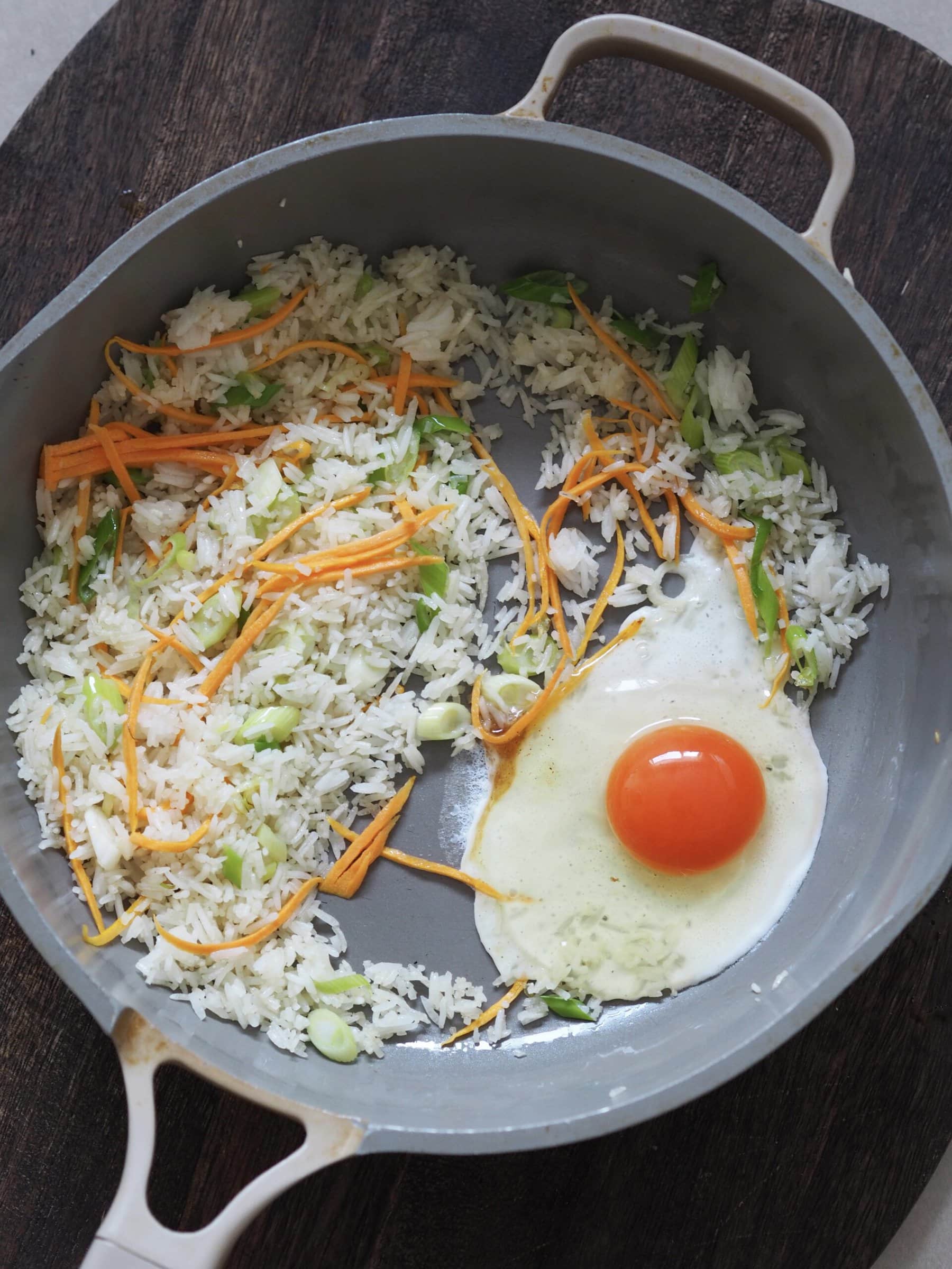 frying an egg for egg fried rice.