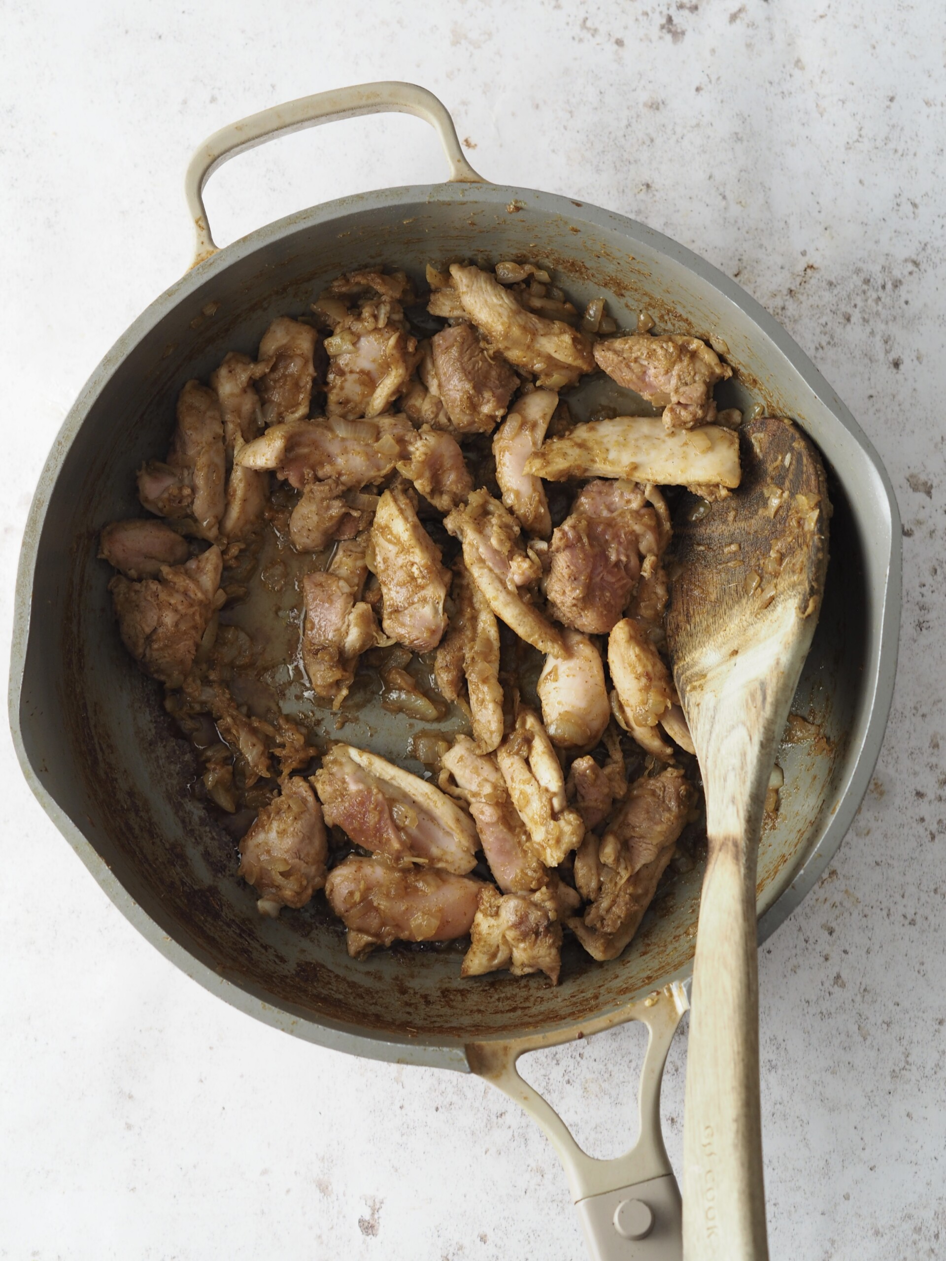 frying chicken before adding in the sauce.