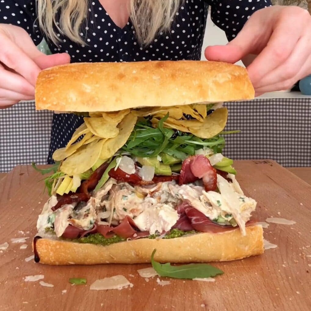 topping the lid of the chicken mayonnaise sandwich.