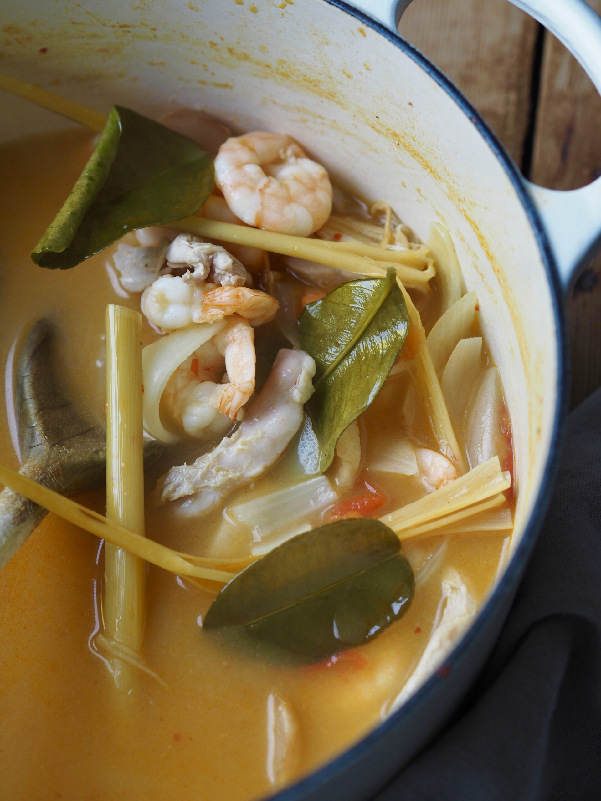 adding prawns, lemongrass and ginger.