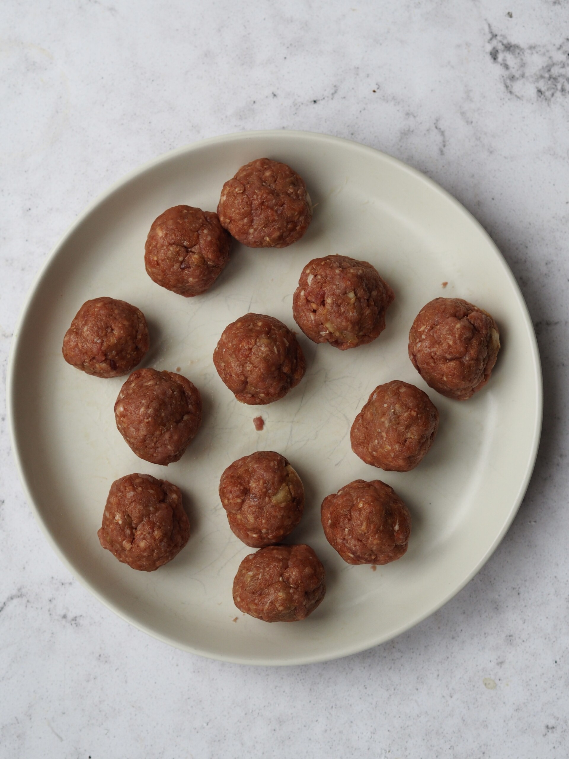 shaping lamb meatballs.