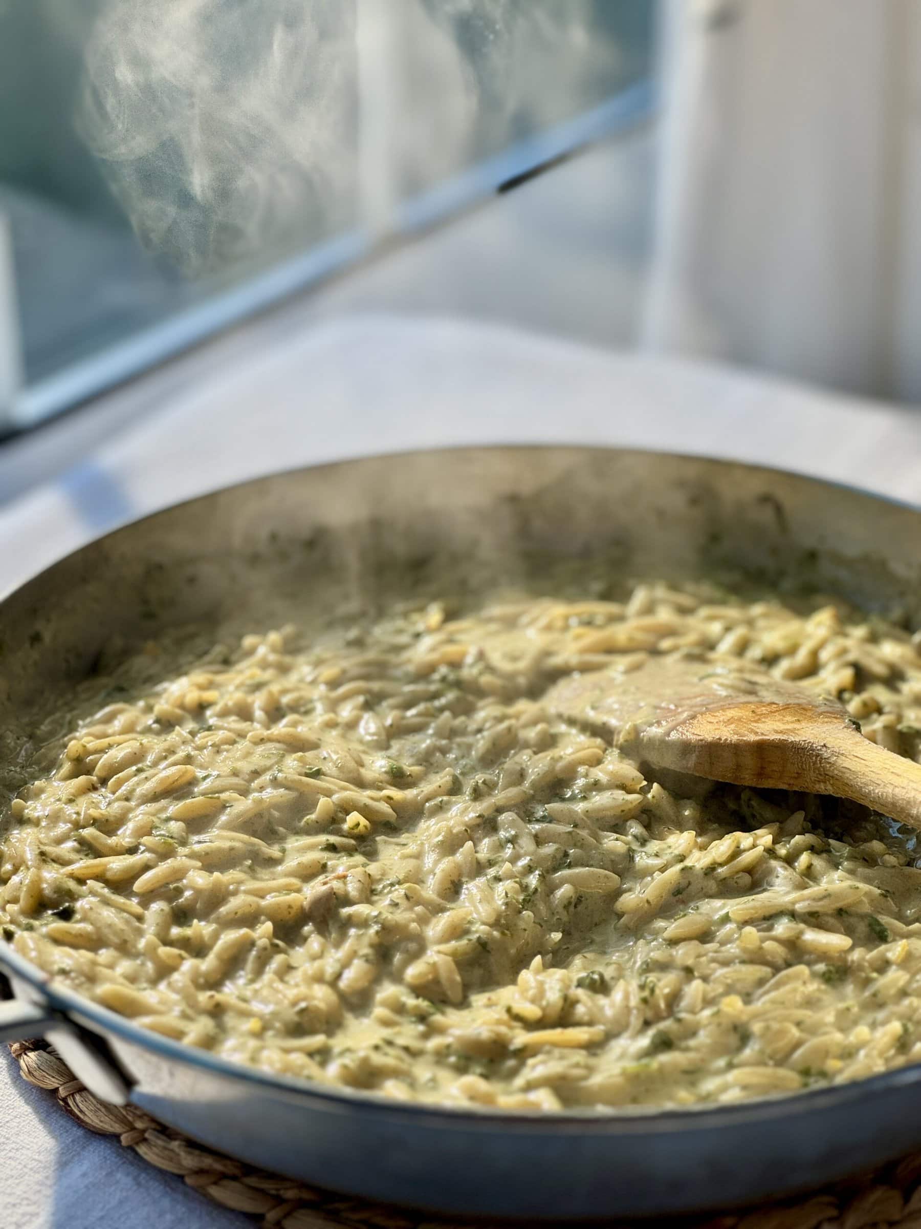 steaming pan of lemon orzo.