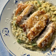 lemon chicken orzo in a bowl with blue flowers.