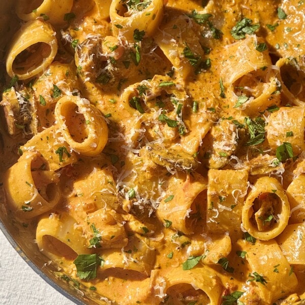 prawn chorizo pasta in a stainless steel pan.