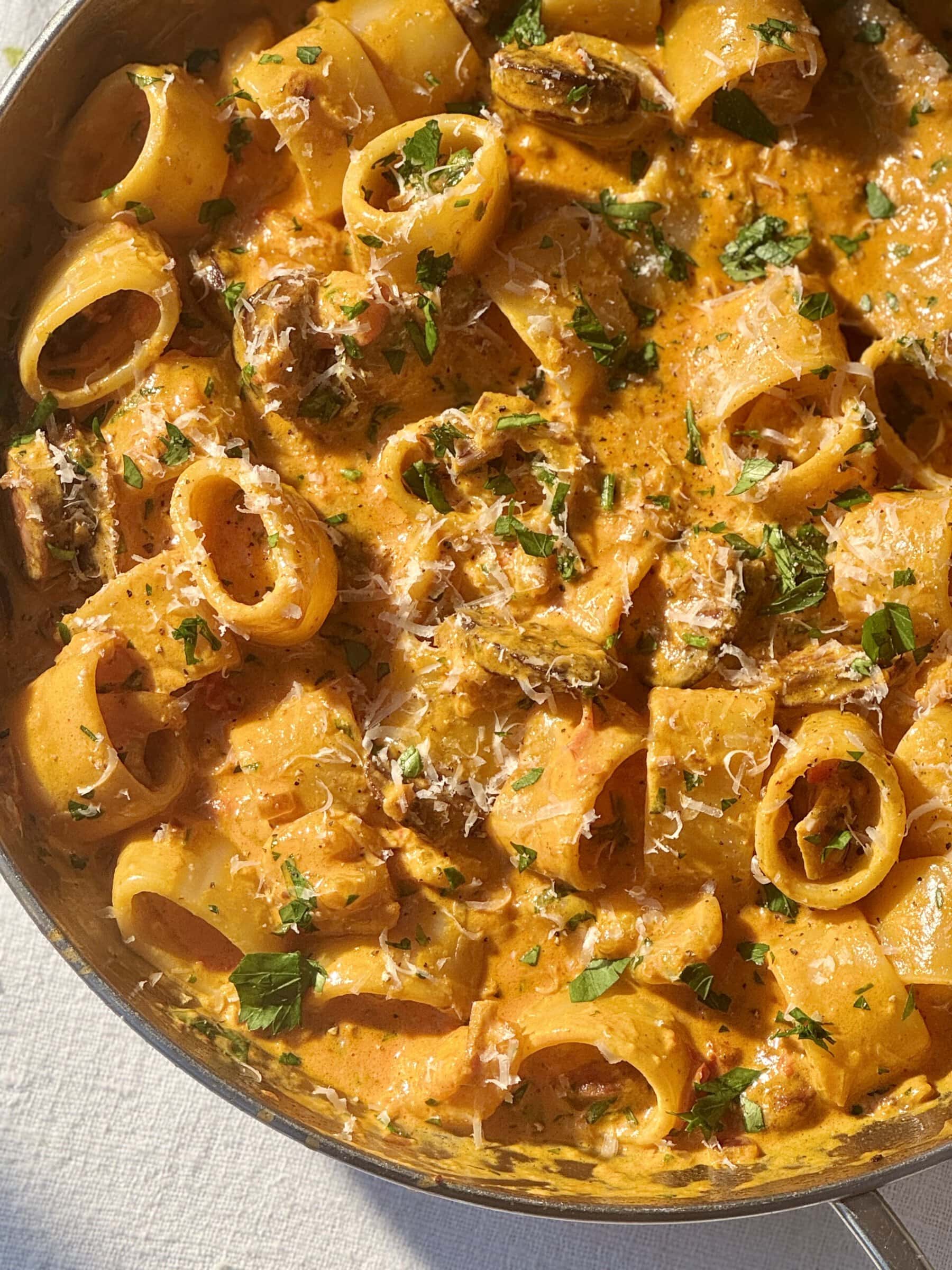 prawn chorizo pasta in a stainless steel pan.