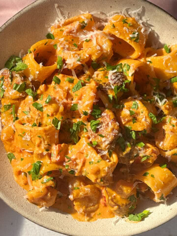 prawn chorizo pasta in a beige bowl.