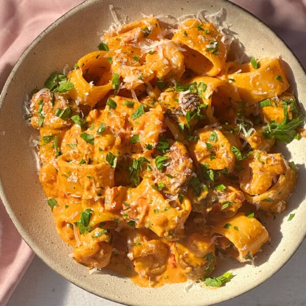 prawn chorizo pasta in a beige bowl.