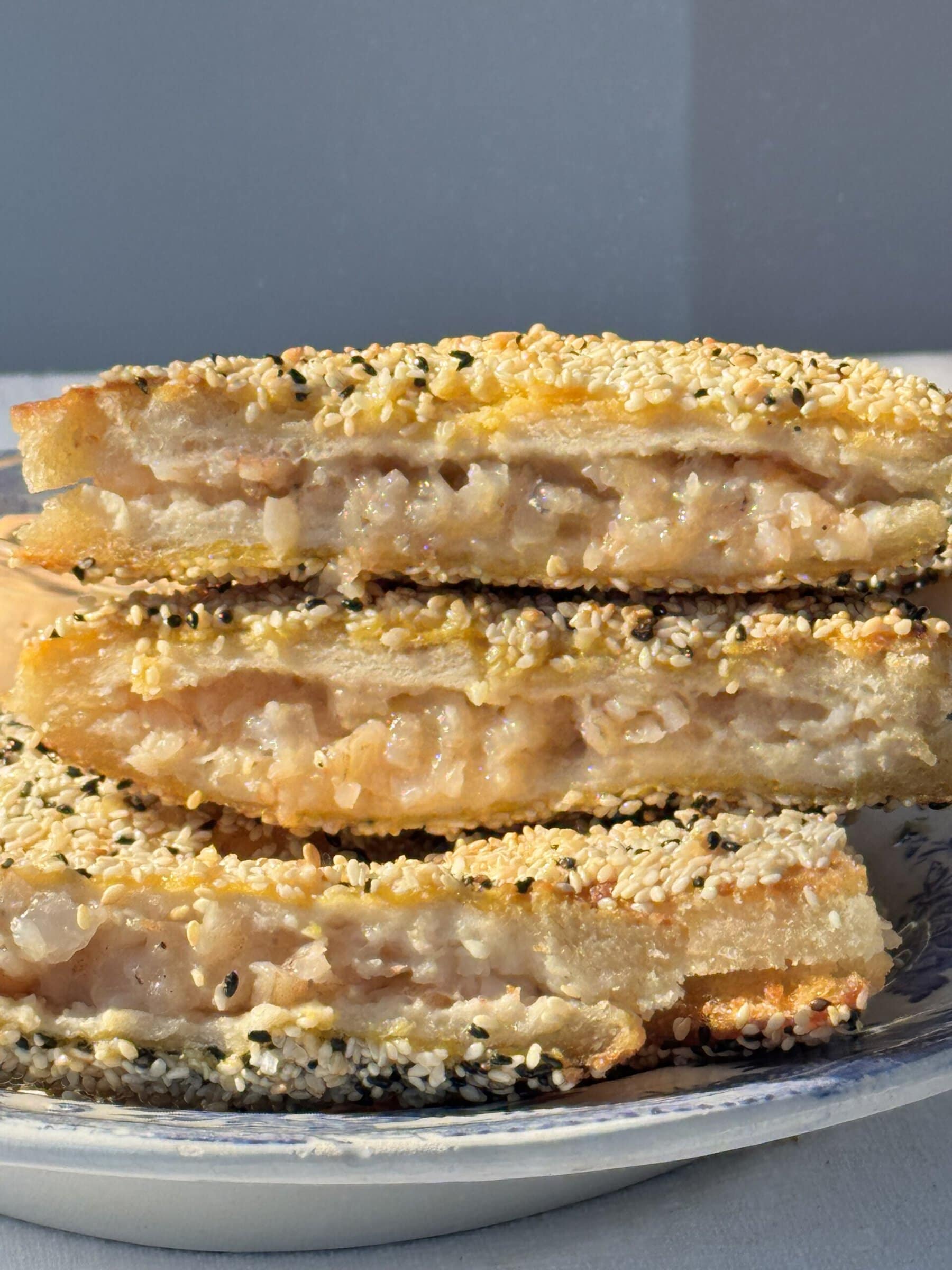 sesame prawn toasts stacked up.