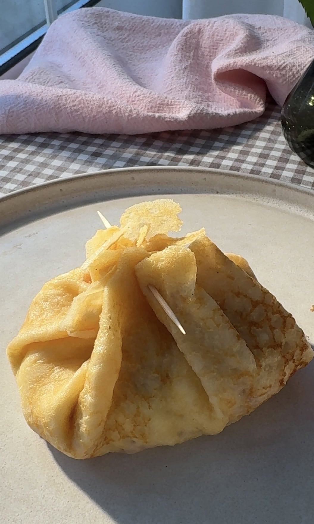 aumonieres de crepes with cocktail stick.