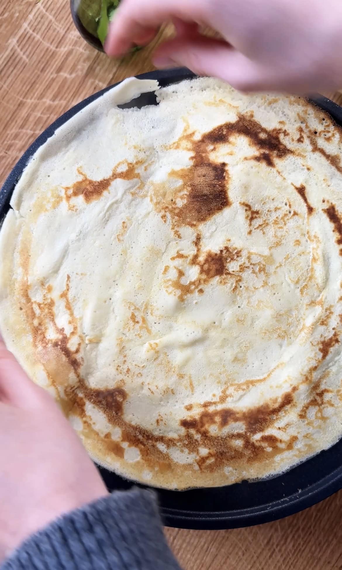 frying banana crepes.