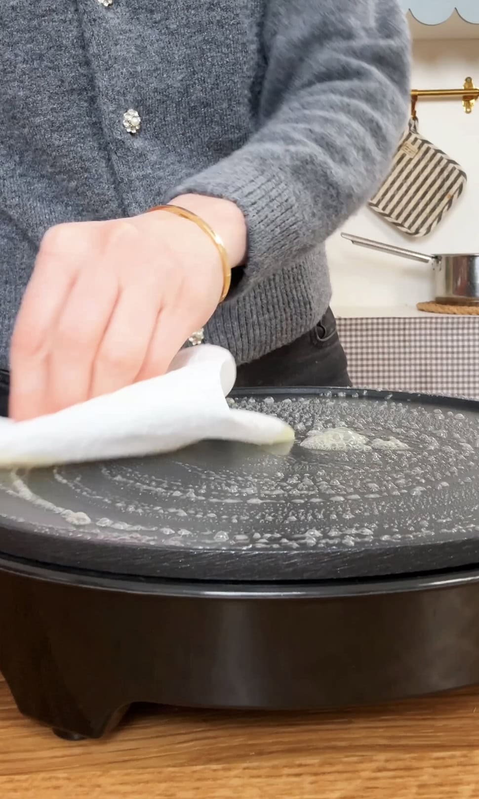 melting butter onto a pan.