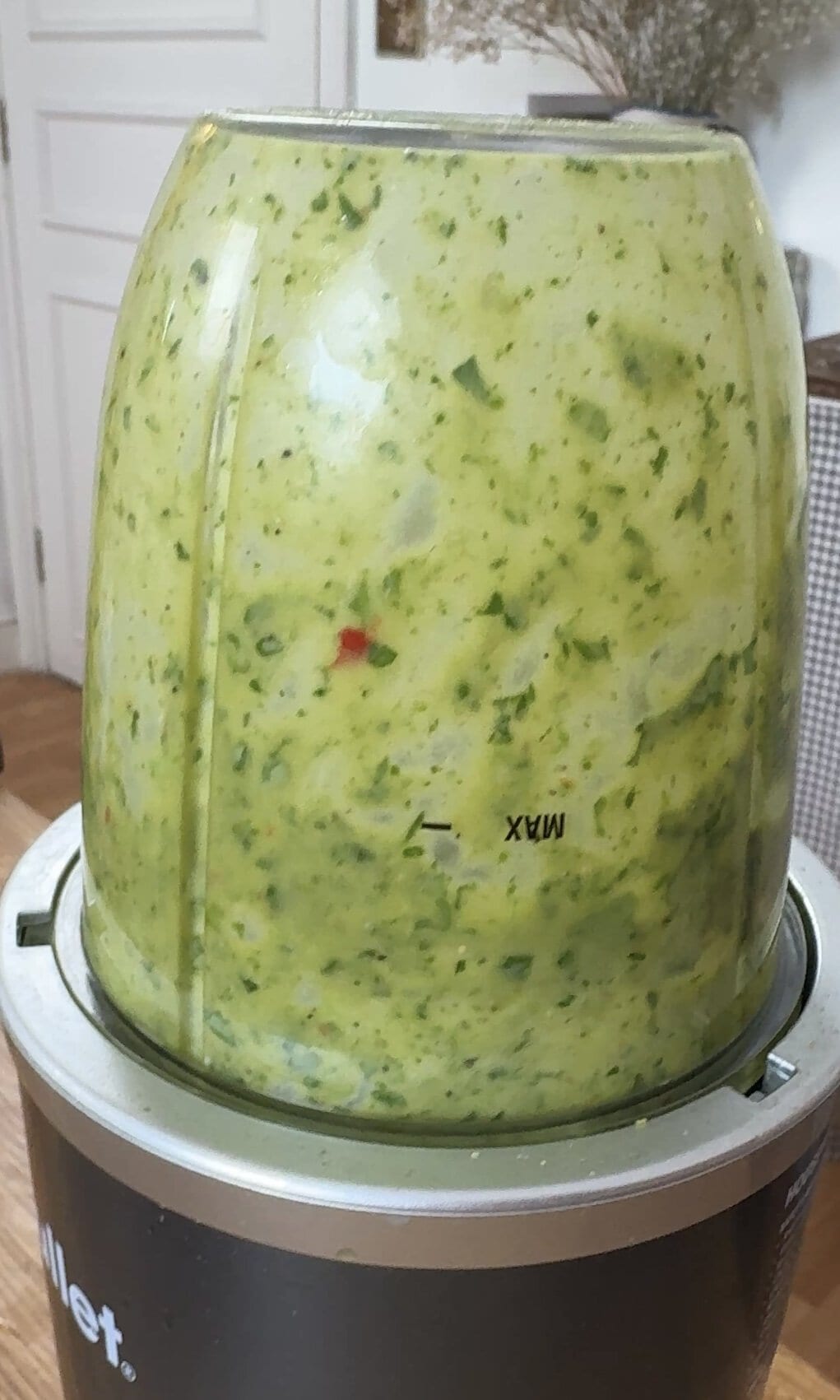 blending green herby sauce.