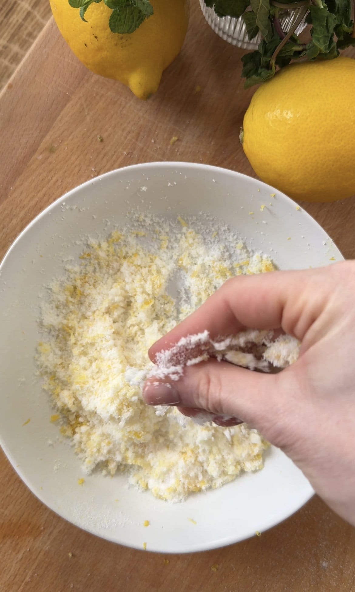 mixing sugar and lemon zest together.